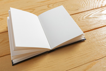 Fototapeta premium Book on the old Wooden table