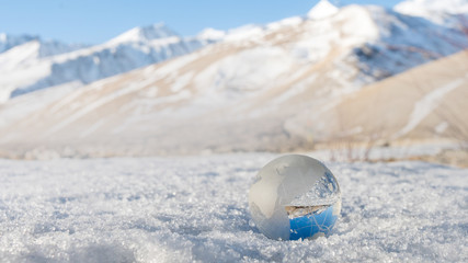 Earth Grass in Snowy for safe World Concept
