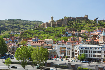 Naklejka premium Panorama view of Tbilisi, capital of Georgia country. Old part of city with Narikala fortress on the hill.