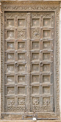 Jaisalmer, India. Old crooked wooden door. Usual entrance to the town house