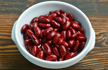 Healthy Benefits of Red beans.
Red beans in white bowl on wooden background.