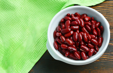 Healthy Benefits of Red beans.
Red beans in white bowl on wooden background.