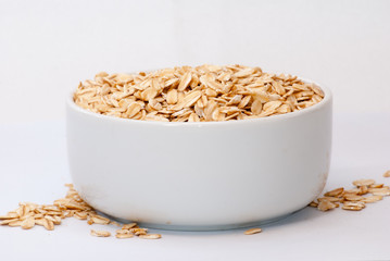 Oatmeal in white cup with white background