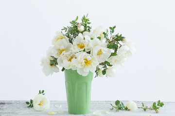 white roses in vase