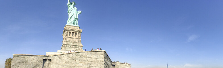 Fototapeta na wymiar Panoramic view of Statue of Liberty and Manhattan