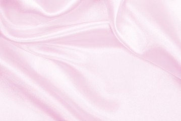 Smooth elegant pink silk or satin texture as wedding background. Luxurious background design