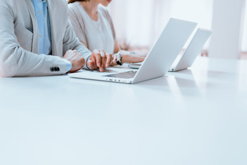 Business people, hands and computers