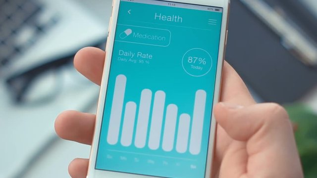 Smartphone app. Checking medication monitoring on health app on the smartphone