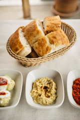 meze small dishes on the table: hummus, Antep Ezmesi