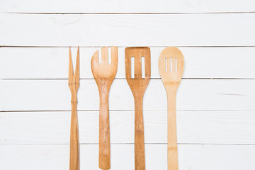 top view of various wooden spatulas on white tabletop