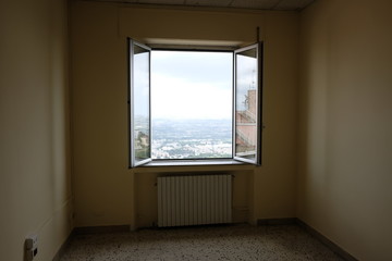 Empty office with open window
