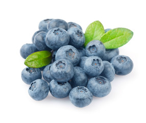 Heap of blueberries with leaves isolated on white background