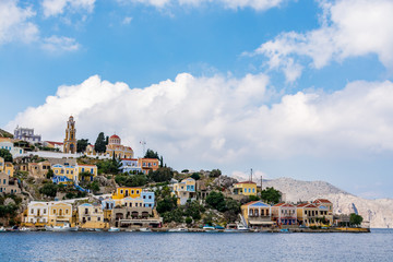 Fototapeta na wymiar Colourful, picturesque houses at Symi island, Greece