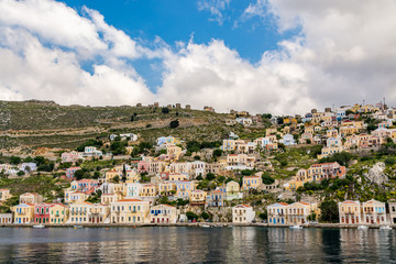 Fototapeta na wymiar Colourful, picturesque houses at Symi island, Greece