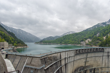 The view of Kurobe Dam. The Kurobe Dam or Kuroyon Dam is a variable-radius arch dam on the Kurobe River in Toyama Prefecture, Japan