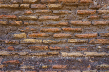 Old aged red brick wall texture as background.