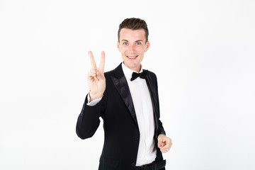 Young man master performing on the stage. Man in black suit on white background with copy space