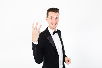 Young man master performing on the stage. Man in black suit on white background with copy space