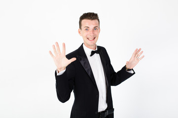 Young man master performing on the stage. Man in black suit on white background with copy space
