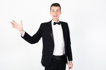Young man master performing on the stage. Man in black suit on white background with copy space
