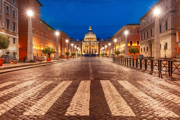 Fototapeta na wymiar View of The Papal Basilica of St. Peter in the Vatican or Saint Peter Cathedral during morning blue hour in Rome, Italy.