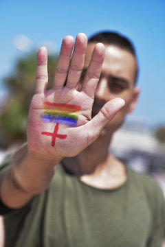 rainbow flag and plus sign, for LGBTI HIV-positive people