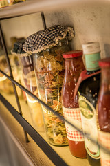 Pasta in jar and bottles of tomato sauc