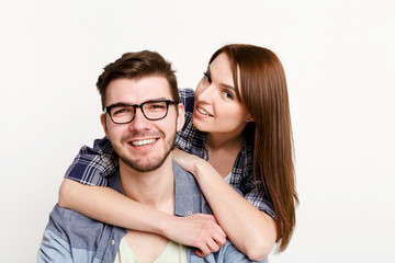 Happy casual couple posing to camera, isolated