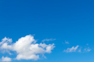 Blue sky with fluffy clouds.