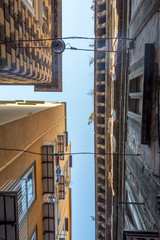 Fototapeta na wymiar Small gap between buildings in Naples, Italy