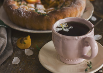 Cup of tea, homemade pie and the petals of the Apple-tree