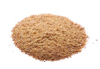 Crushed flaxseed isolated on white background
