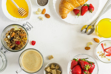 set of healthy ingredients for breakfast on white background. Top view with copy space