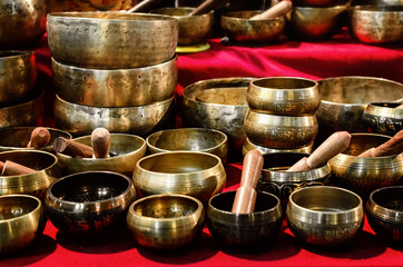 many tibetan singing bowls with mallets