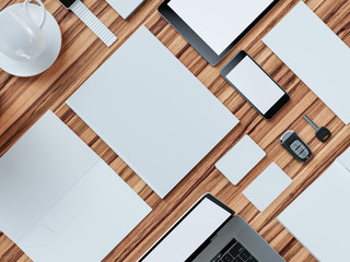 Computer, laptop, digital tablet, mobile phone, virtual headset and newspaper on wooden table. IT concept.