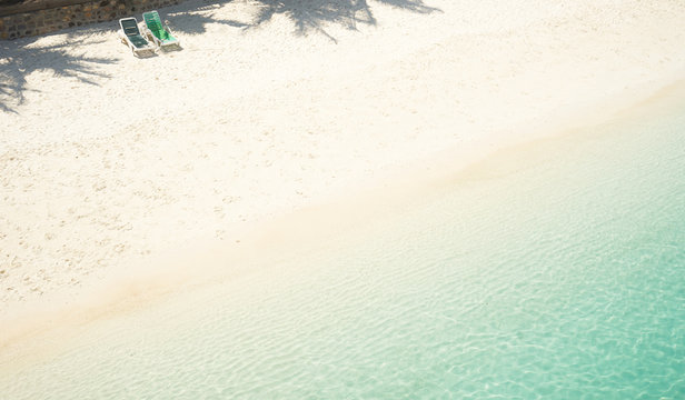 Beach Tropical With Two Relaxing Chair ,white Sandy And Crystal Water Seen From Above. Rawa Island ,Malaysia .