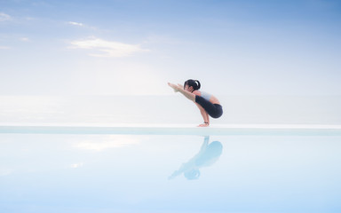 Fototapeta na wymiar Asian woman practice yoga on the beach