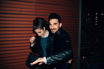 Couple avoiding paparazzi, Florence, Italy