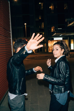 Couple avoiding paparazzi, Florence, Italy