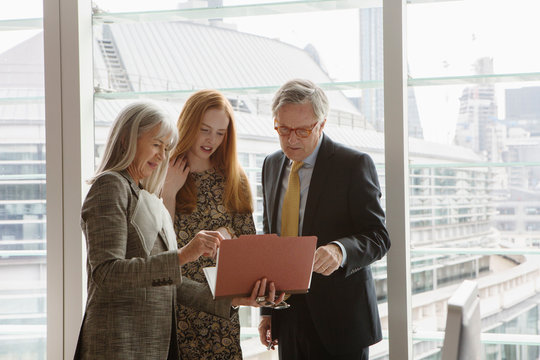Business colleagues having meeting, London, UK