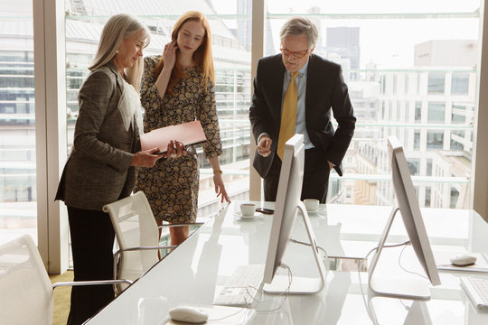 Business colleagues having meeting, London, UK