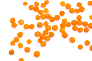 Red lentils on a white background