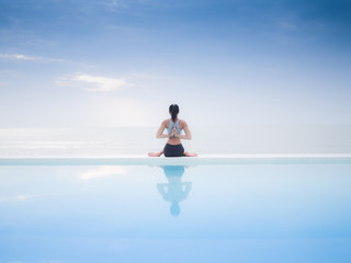 Asian woman practice yoga on the beach