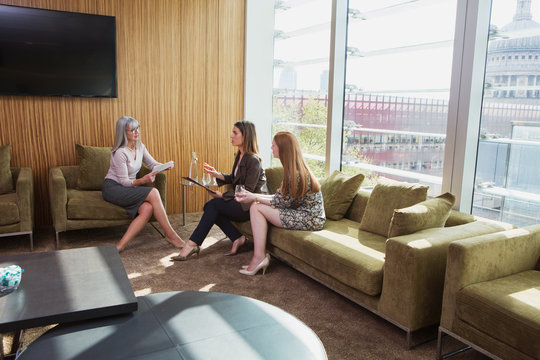 Businesswomen meeting on office sofa, London, UK