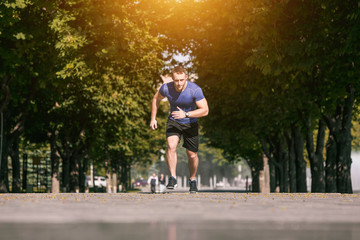 Man running in park at morning. Healthy lifestyle concept