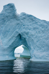 Huge iceberg with window in Antarctica