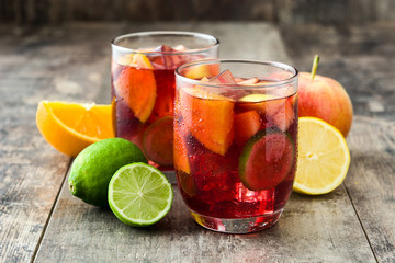 Sangria drink in glass on wooden table
