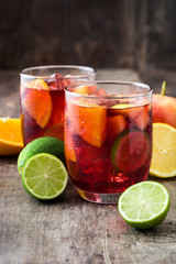 Sangria drink in glass on wooden table
