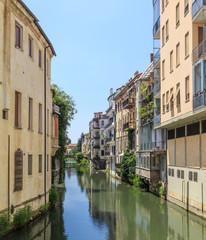 Fototapeta na wymiar City canal and historic townhouses in old town of Padua, Veneto, Italy