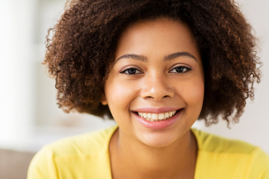 close up of happy african young woman face